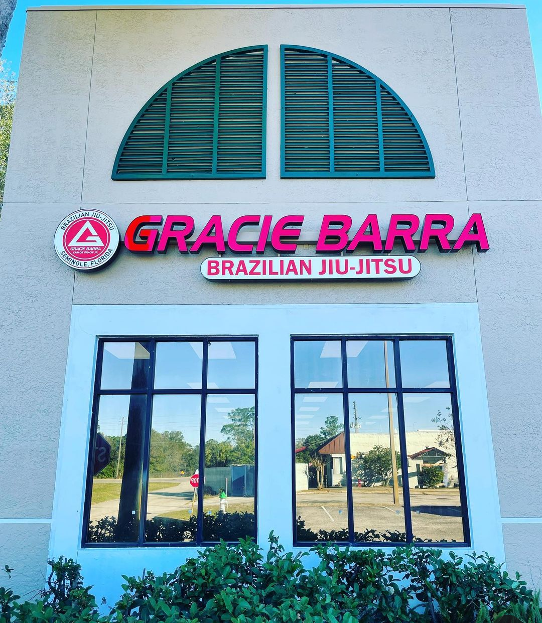 Exterior storefront of Gracie Barra Seminole's Brazilian Jiu-Jitsu academy at 1060 W SR 434, Longwood, FL, with red Gracie Barra signage above the entrance.